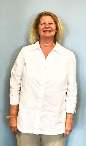 Lady standing, posing for a photo