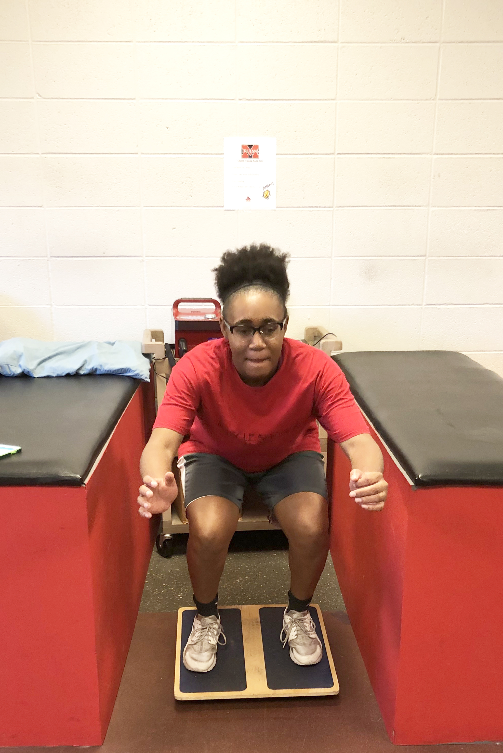 Young girl exercising on a balance board