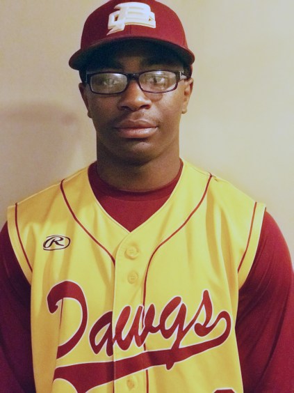Teenage athlete in baseball uniform that says Dawgs on the shirt