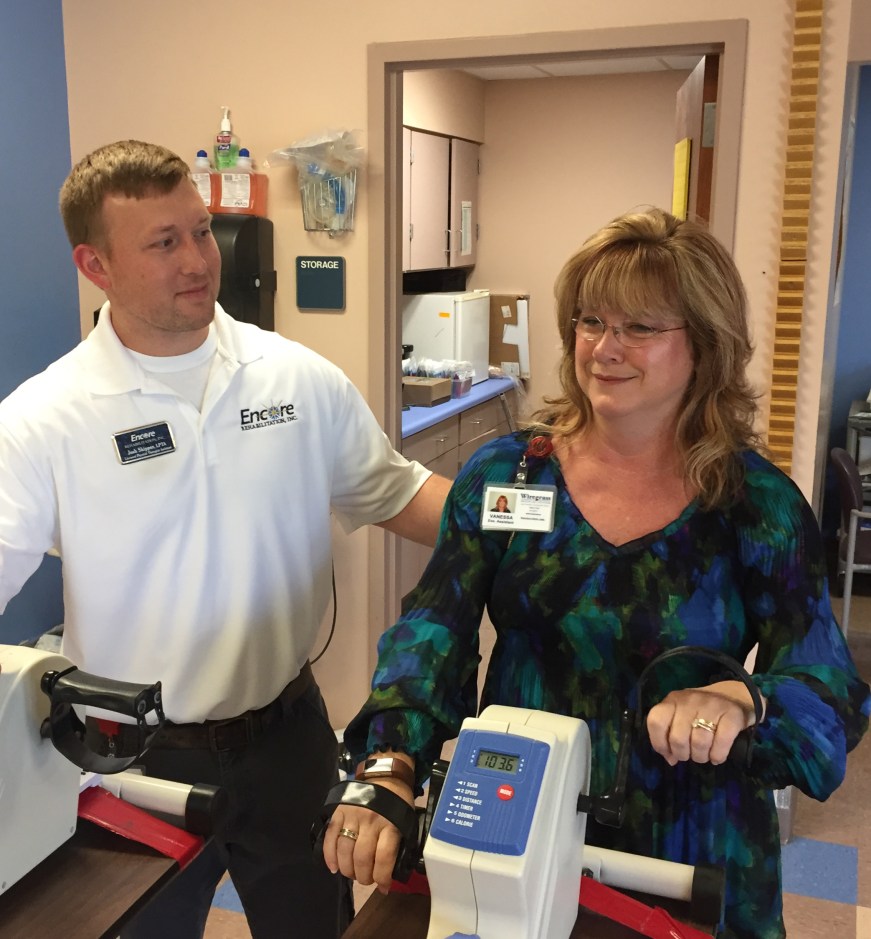 Vanessa Folsom is assisted in her rehab by Encore Rehabilitation Physical Therapist Assistant Josh Skipper.