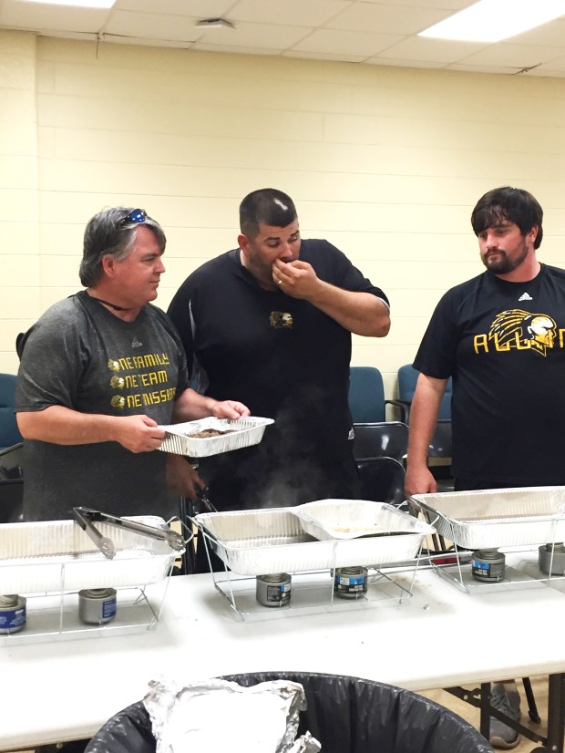 End of Summer Workouts Meal for the Oak Grove (Ms.) Warriors showing Asst. Football Coach Mitchell, Athletic Trainer Sam Morris, and Head Football Coach Drew Causey.