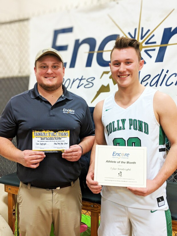 Encore Sports Medicine Athletic Trainer Gage Brewer with Tyler Boatright, Athlete of the Month for Vinemont High School and Encore Rehabilitation-Cullman