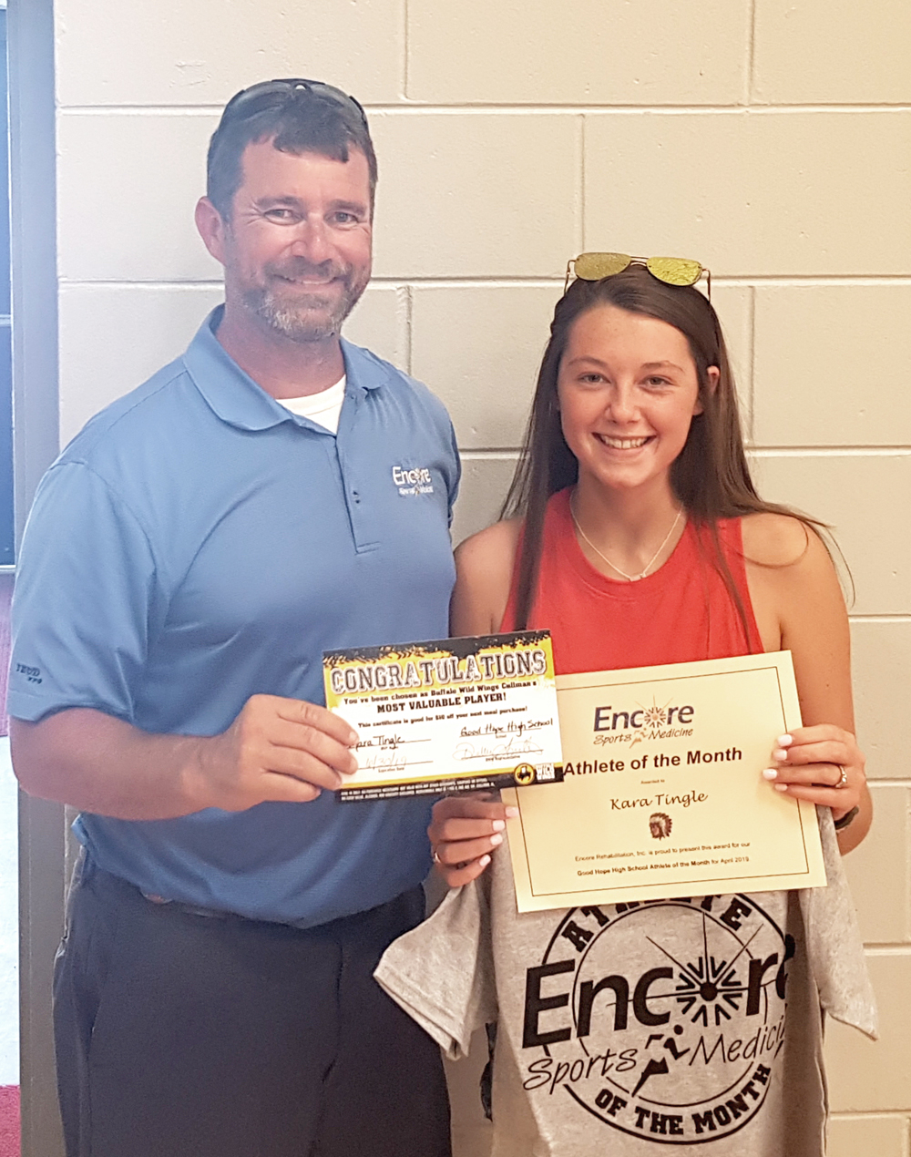 Kara Tingle, multi-sport athlete, is Athlete of the Month for Good Hope High School and Encore Rehabilitation-Culllman. She is pictured here with Encore Sports Medicine Athletic Trainer Bo Shirey. #EncoreRehab