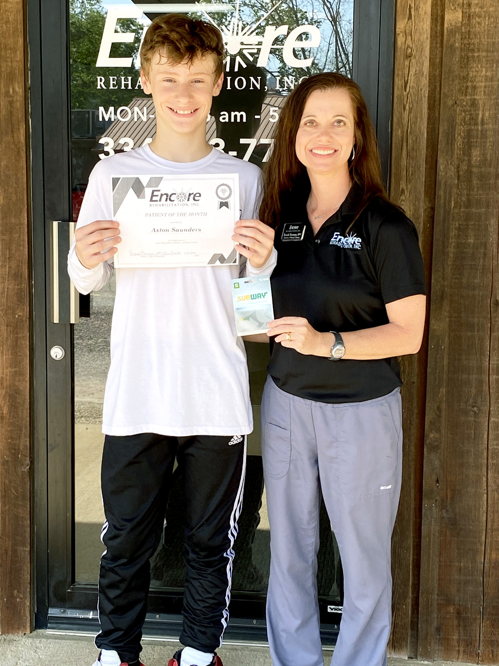 Axton is shown here with Clinic Director and Physical Therapist Brandi Norman.