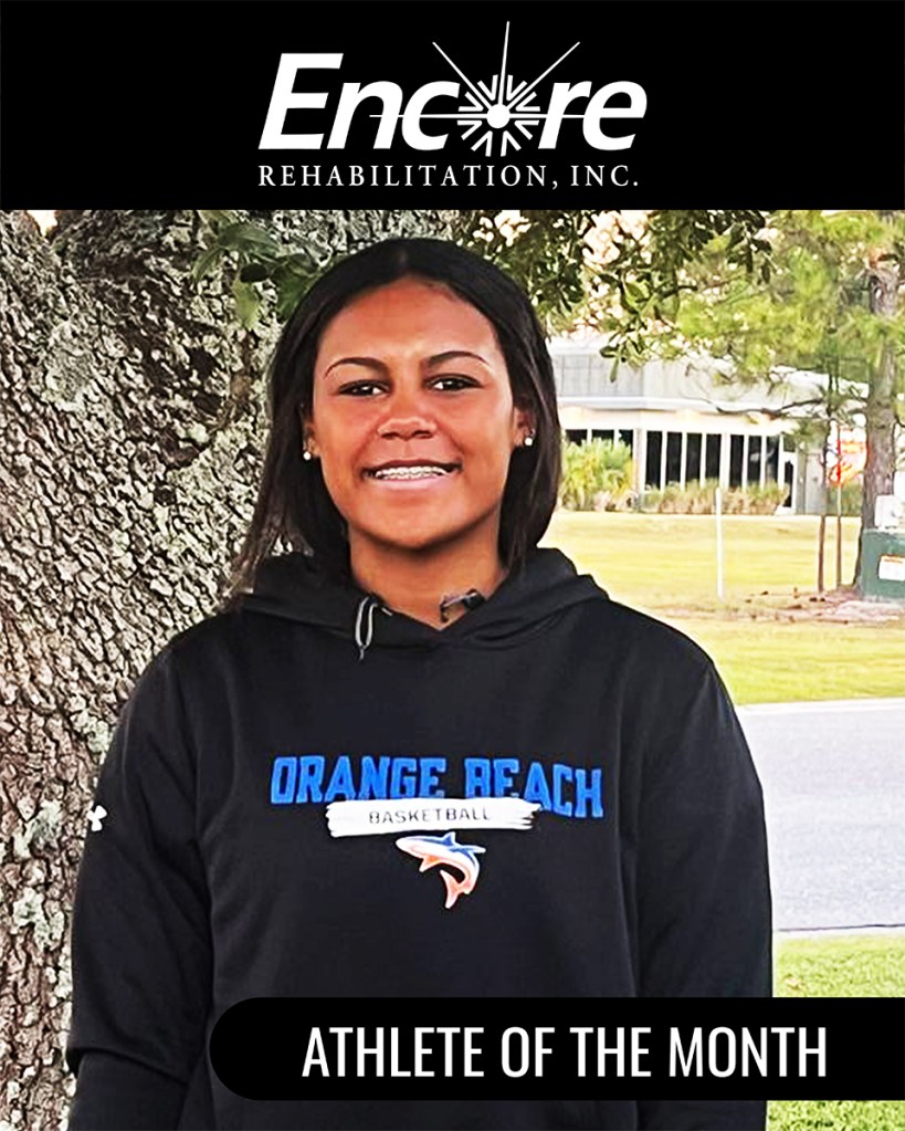 Young female middle-aged athlete in black sweat shirt that reads Orange Beach Basketball with a frame of Encore Rehabilitation Athlete of the Month
