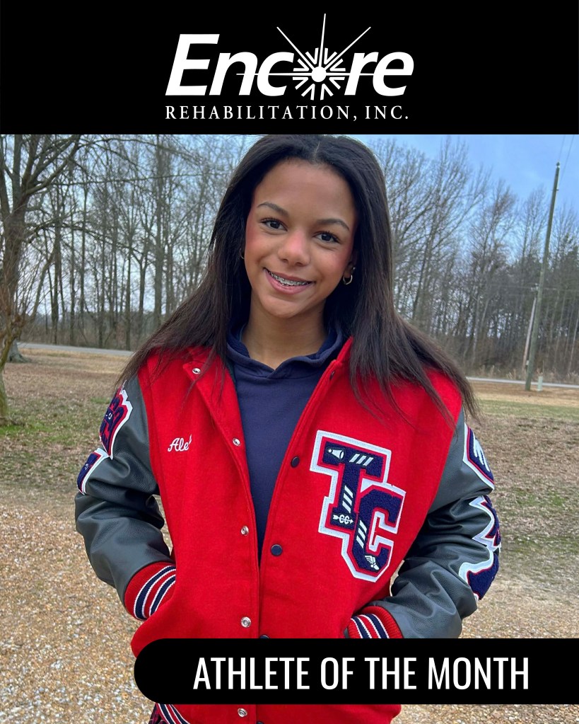 Young girl smiling with letterman jacket on with the initials TC for Tupelo Christian Prep School. She is being recognized as an Encore Rehabilitation-Tupelo, MS, Athlete of the Month!