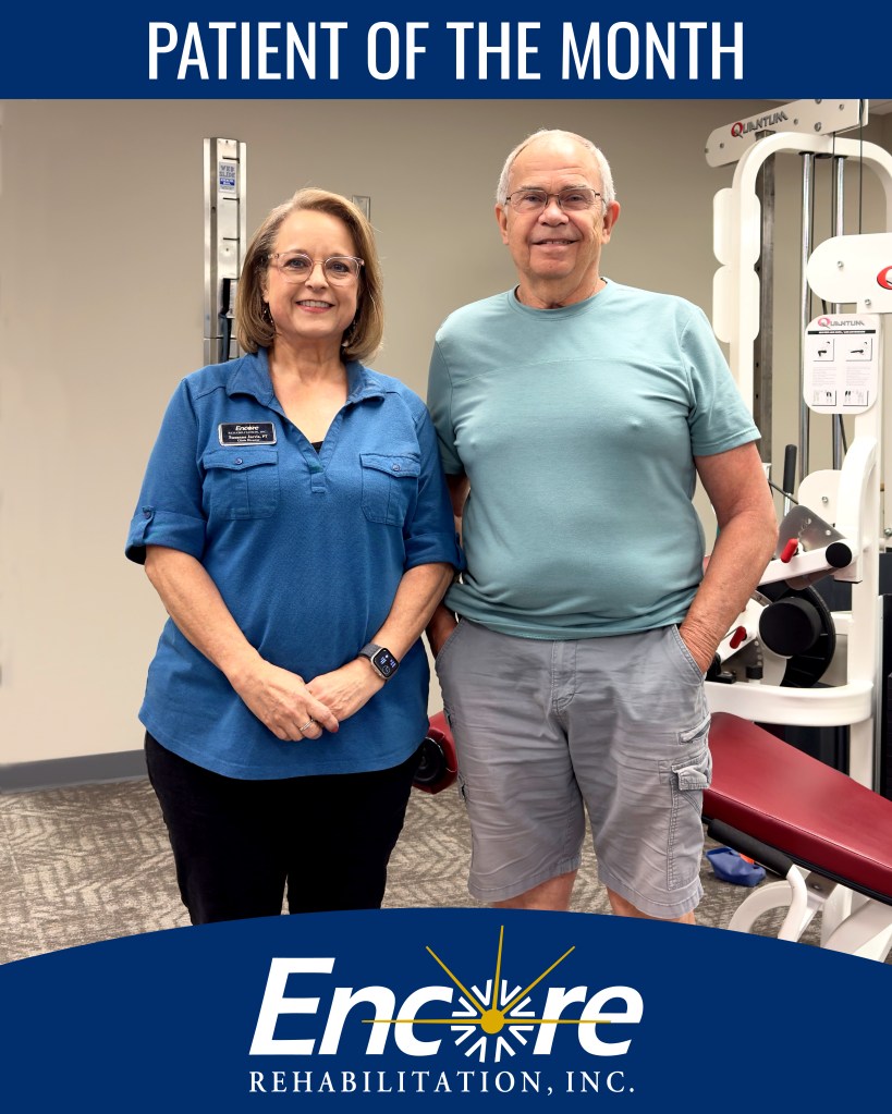 Older male smiling with his physical therapist at the Encore Rehabilitation-Pelham clinic.