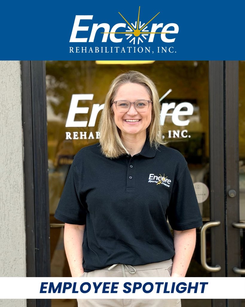 A smiling employee of Encore Rehabilitation, Inc. stands in front of the company's logo, wearing a black polo shirt and beige pants, with an 'Employee Spotlight' banner at the bottom.